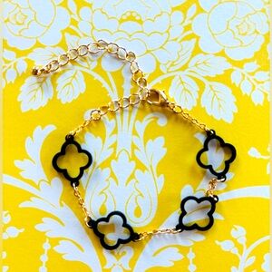 Black with gold tone hollow clover  light weight bracelet